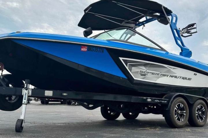 a blue truck parked on the side of a road