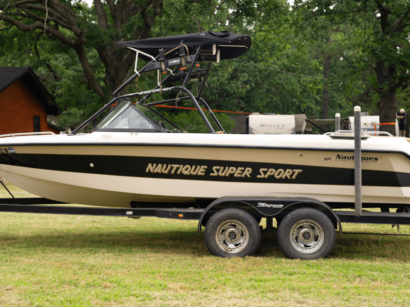 a truck is parked in front of a car