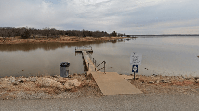 a boat on a river next to a body of water